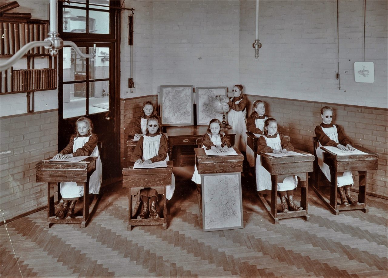 A geography lesson at the Elm Lodge Residential School For Elder Blind Girls, in London, in 1908.