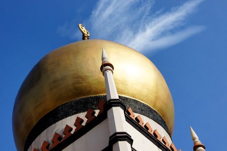 A dome of Sultan Mosque, with the ring of bottle bases visible at the bottom.