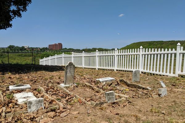 Gravestones with planes taking off above.