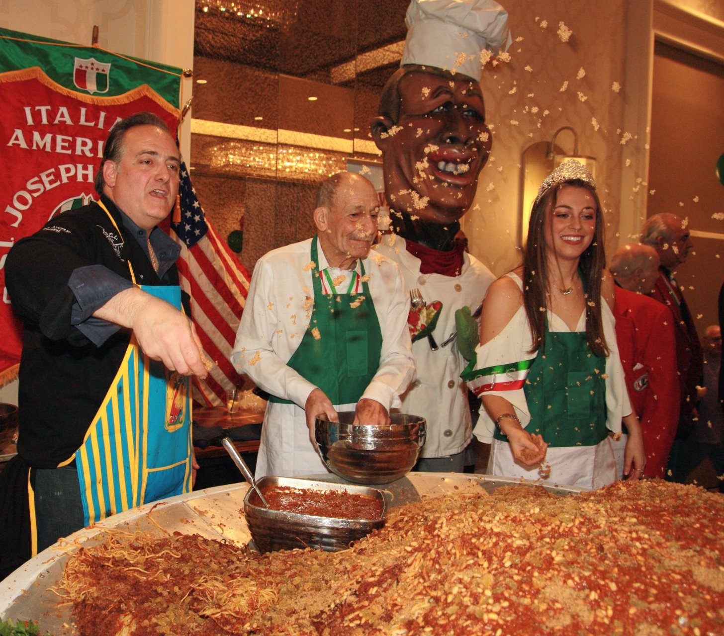 <em>Pignoli</em> nuts go flying as chefs prepare <em>pasta con sarde</em> at the annual St. Joseph's Day pasta dinner.
