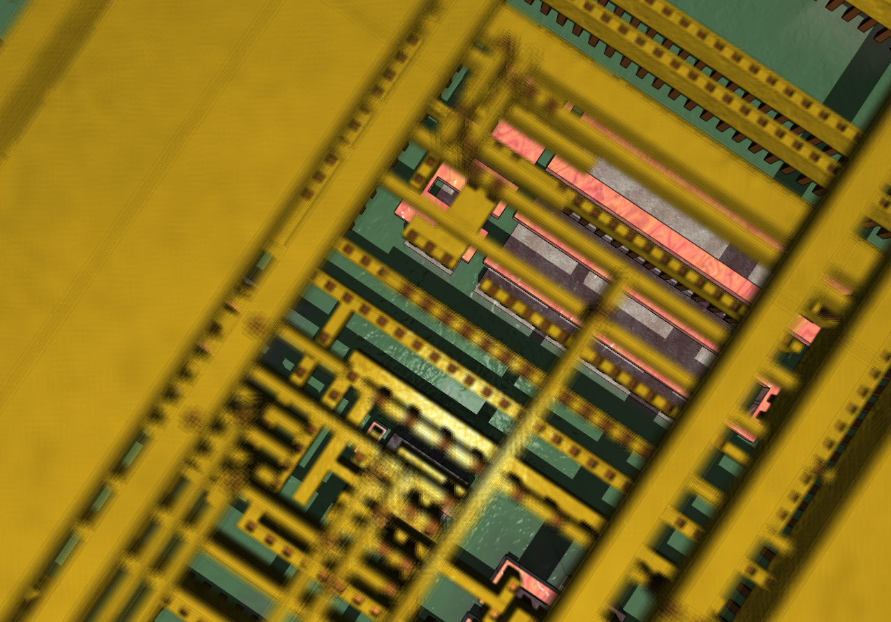 A semiconductor standard cell, close up. The pink parts are silicon.
