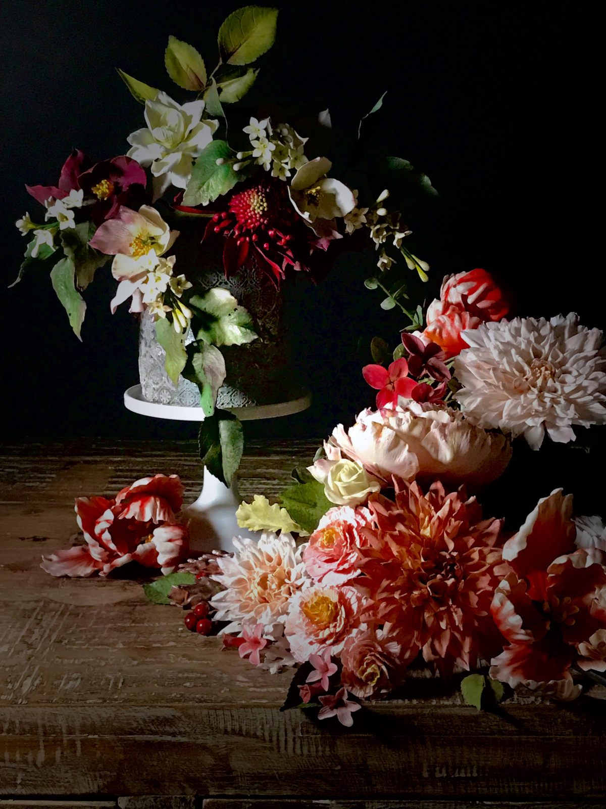 Clients preserve Simon's sugar flowers under glass cloches.