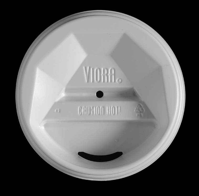 The <em>Viora</em> lid. Its deep well and centered hole are designed to concentrate the coffee's aroma.