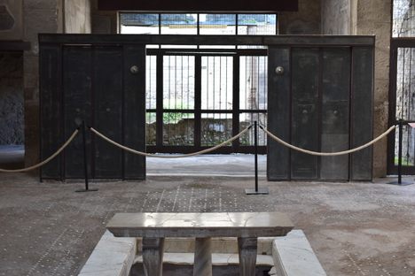 The ancient Roman wooden sliding door still stands. 