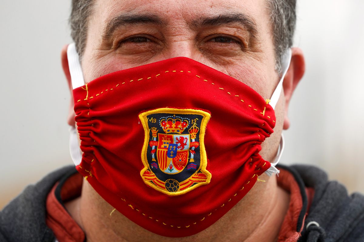 A man in Ronda, Spain, wears a face mask to honor the national football team, April 13, 2020.
