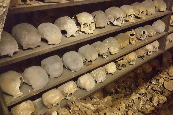 The crypt is full of skulls and other skeletal remains.