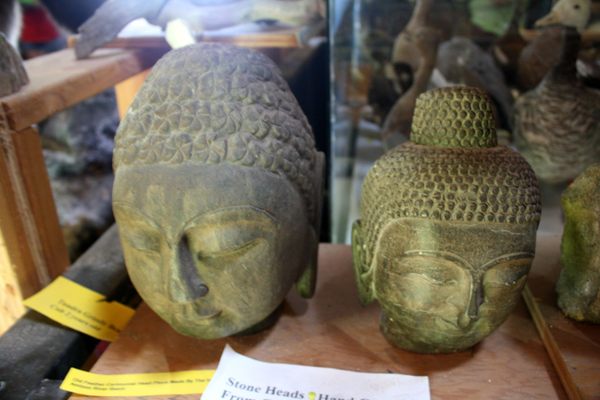 Carved heads on display.