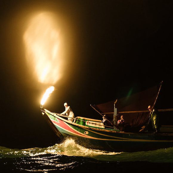 A fire-fishing boat lures sardines to the surface off the coast of Taiwan.