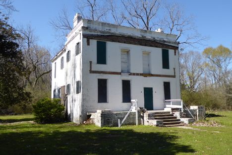 "Behind the big house" - former slave quarters.