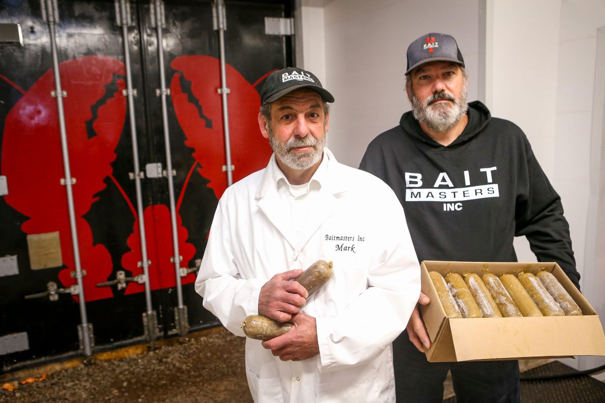 Prevost, left, and MacPhee of Bait Masters, show their alternative lobster bait, a “sausage” made largely of fish byproduct.