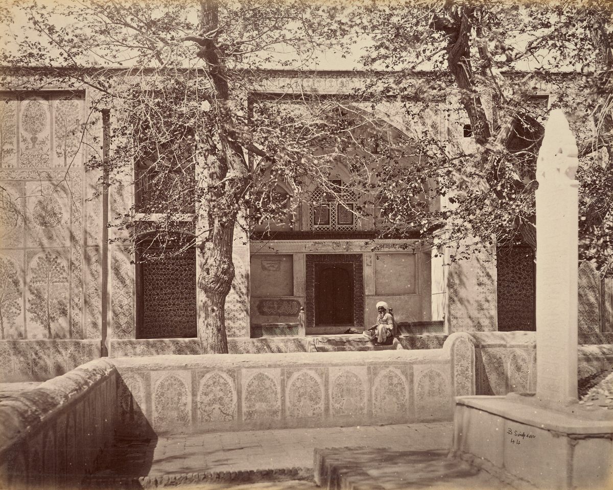 Khirka Sharif—the Shrine of the Cloak—holds a garment believed to have been worn by the Prophet Muhammad. Simpson noted that the man in front of the shrine was said to be 112 years old.