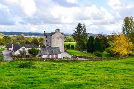 Bailey and the tower with the town of Dalbeattie in the background