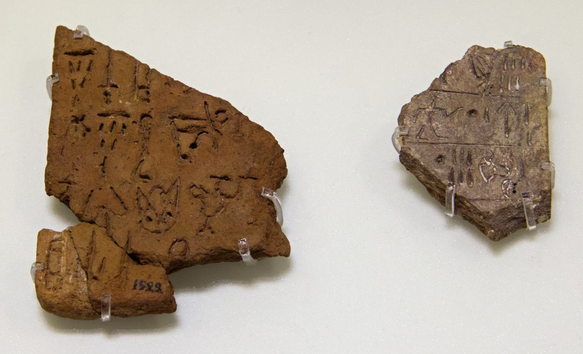 Examples of fragments of Linear A script also found at Phaistos Palace and now on display at the Archaeological Museum of Heraklion.
