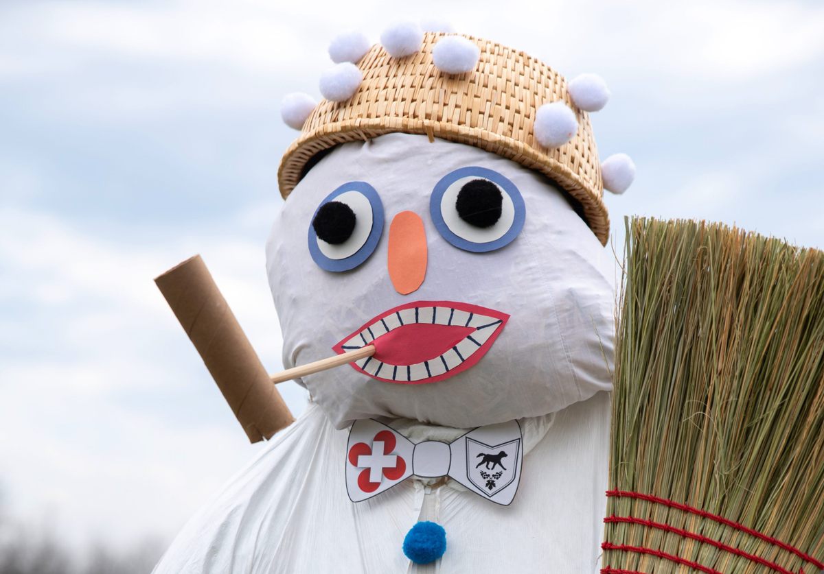 However long this snowman effigy, known as the Bӧӧgg, takes to burn will determine, it's said, the remaining length of winter.