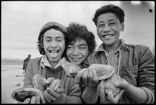 Three boys hold a wealth of toheroa in 1977.