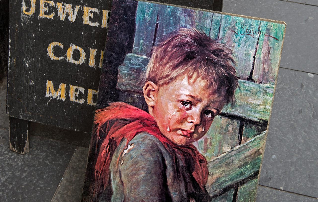 A "crying boy" painting for sale outside an antiques store in Edinburgh.