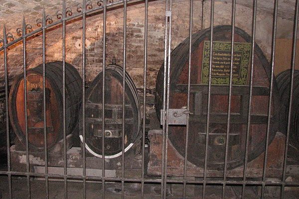 On the right, this barrel is supposed to be filled with the oldest alcohol still stored in the world, a white wine from the year 1472.