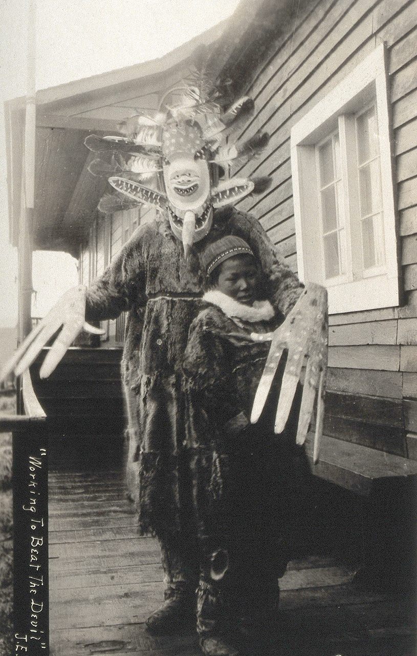 A yup'ik shaman exorcising evil spirits from a sick boy in Nushagak in the 1890s. 