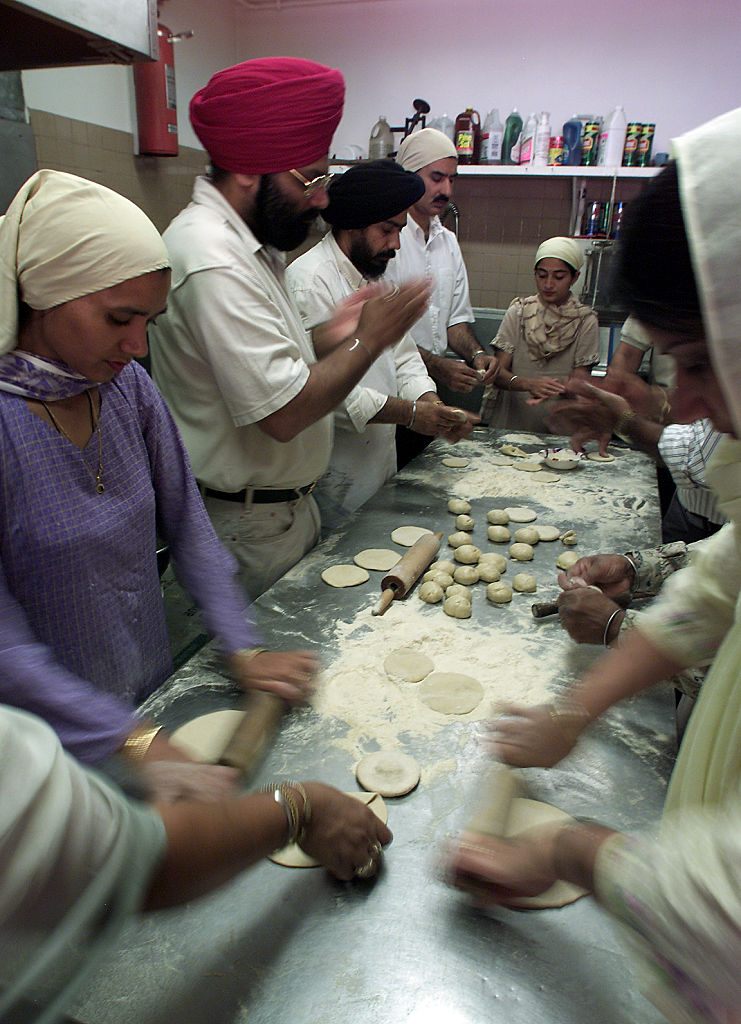 A gathering in the Sikh Gurdwara of Los Angeles prepares a Sunday lunch for the congregation.