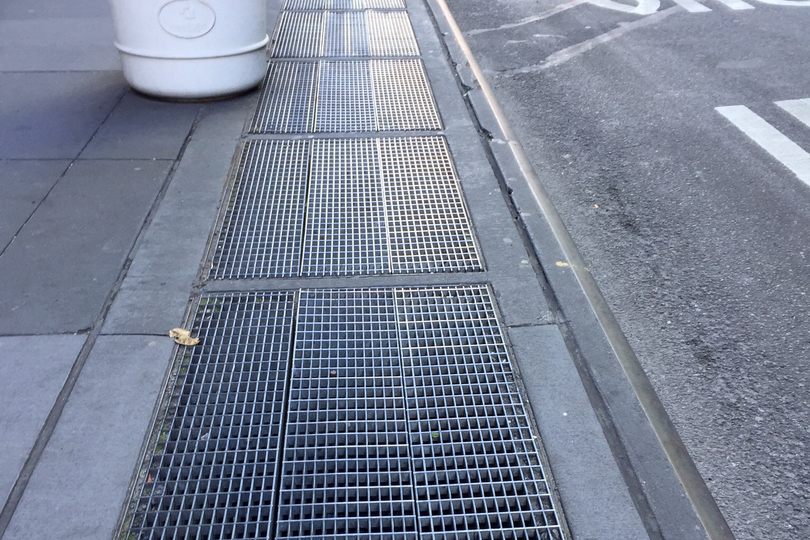 A daytime view of the grate, looking north on Lexington Avenue towards the corner of 52nd Street. 