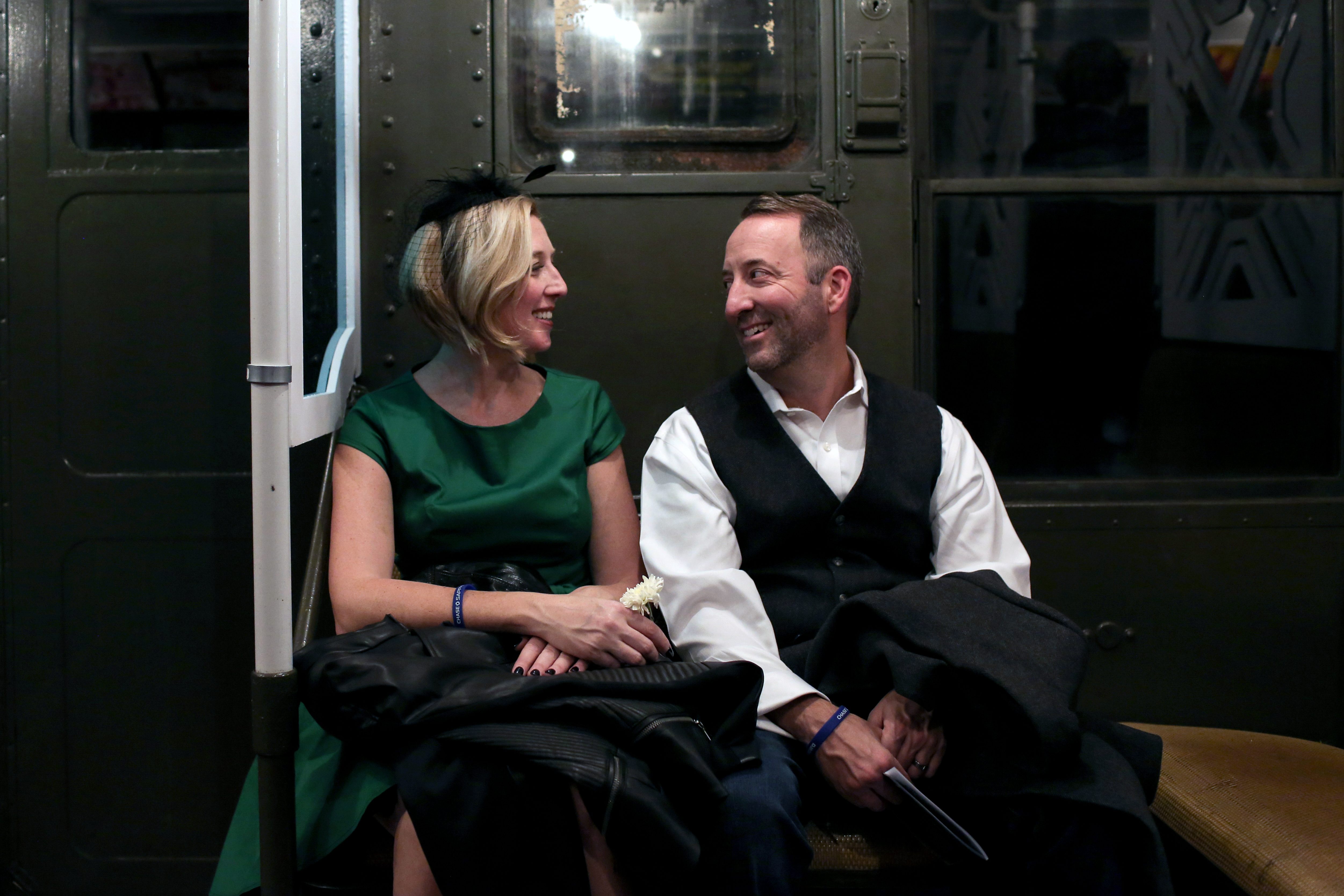 A pair shares a laugh in the 1940s-themed car. 