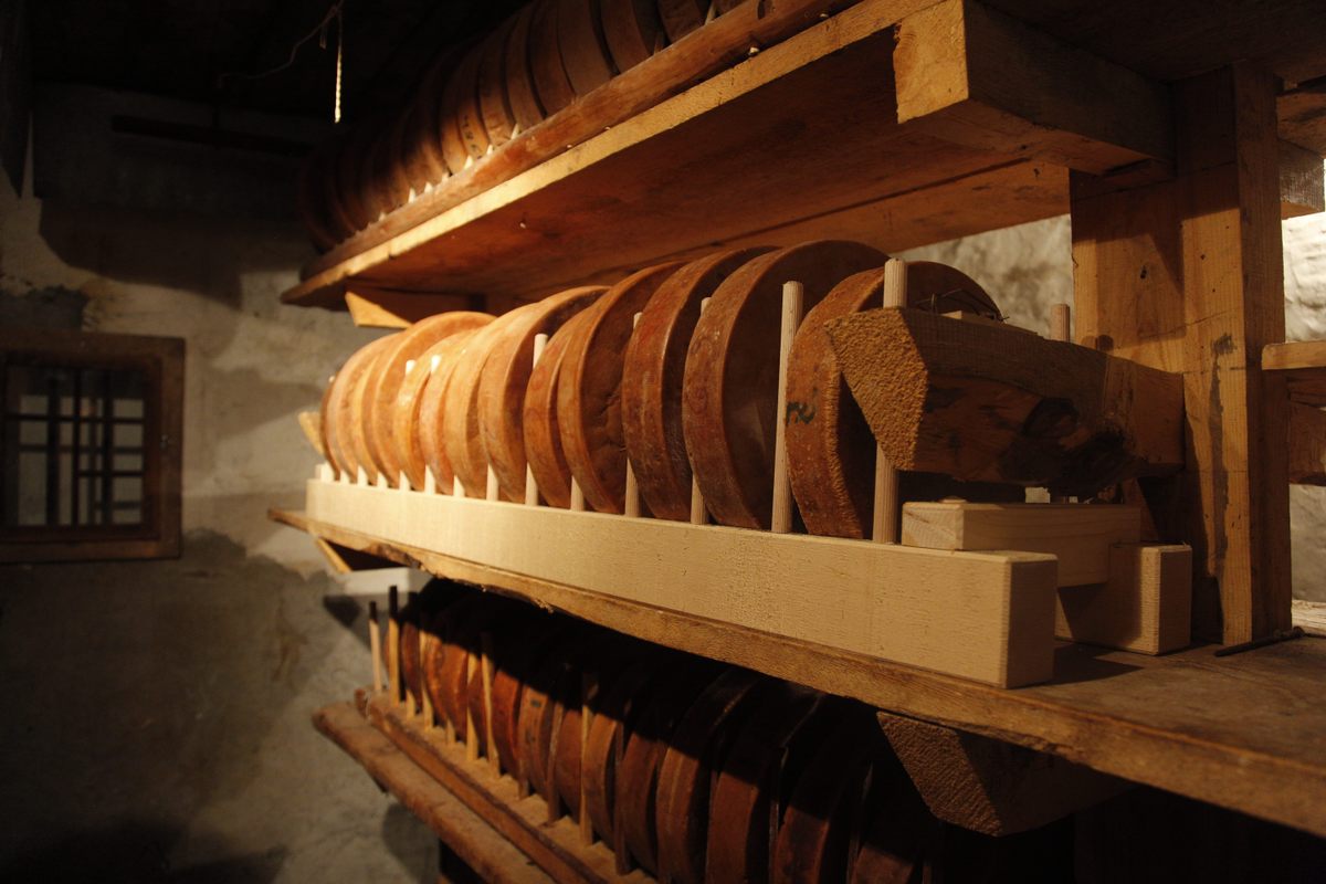 Old wheels are stacked on their sides. Since they're completely firm, they won't lose their shape.