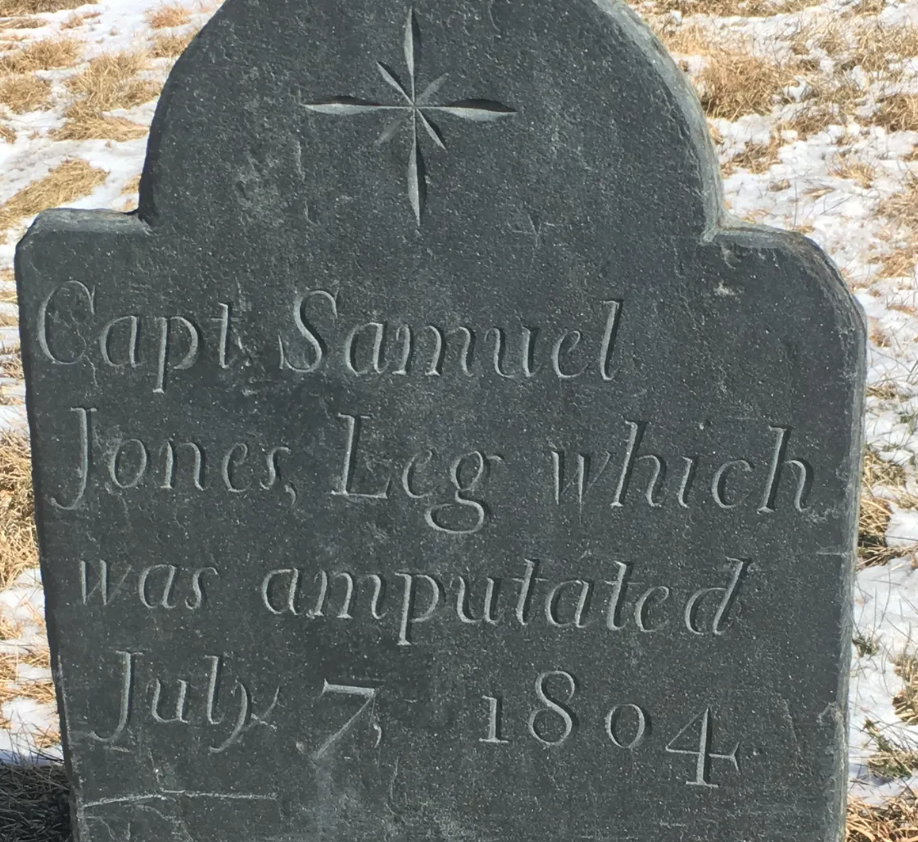 The gravestone has been set in concrete to prevent people from stealing it. 