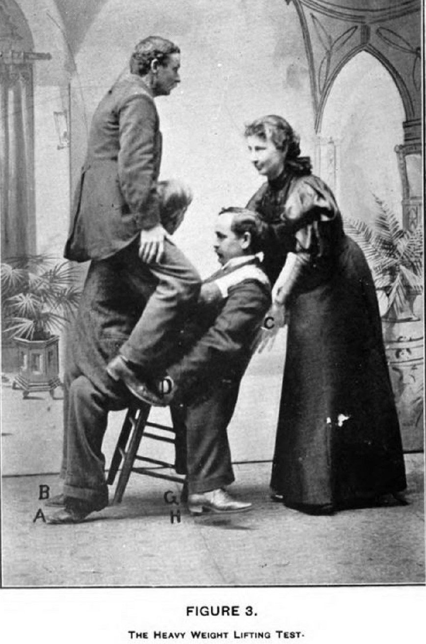 Lulu Hurst demonstrating her technique of overpowering three men on a chair.