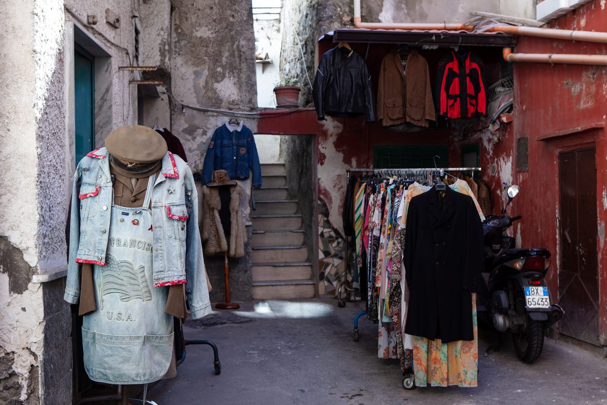 Clothes are on display both indoors and out.