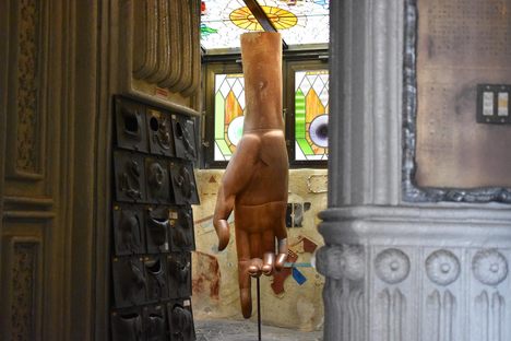Bizarre hand sculpture that also serves as a chair.