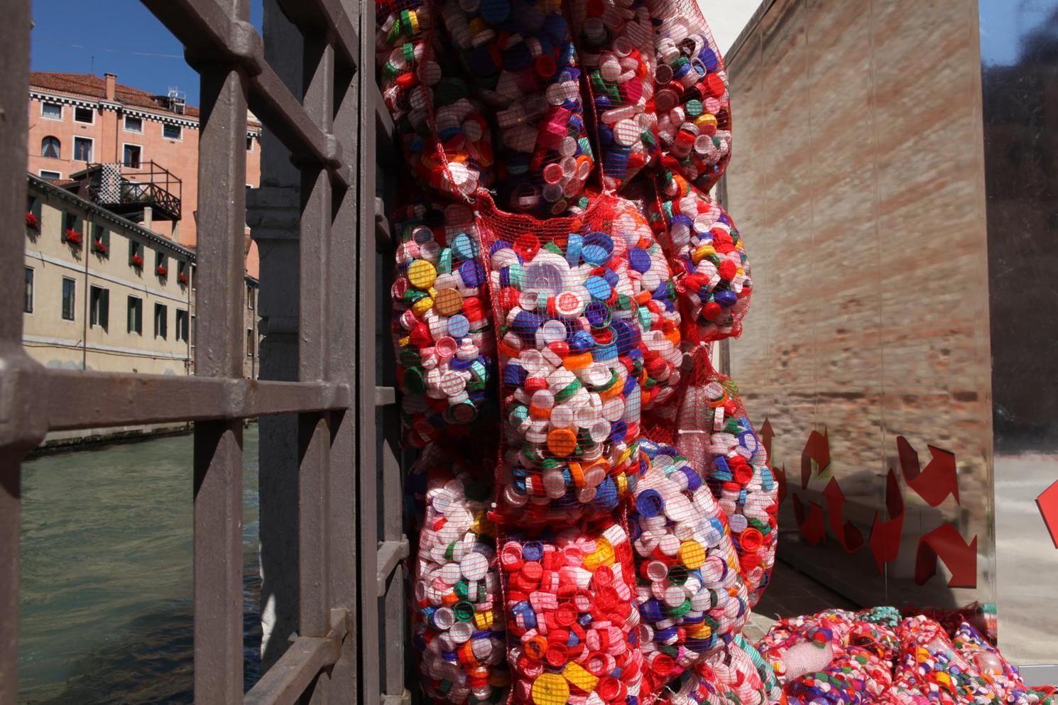 Sacks of plastic bottlecaps in one of Finucci's installations.