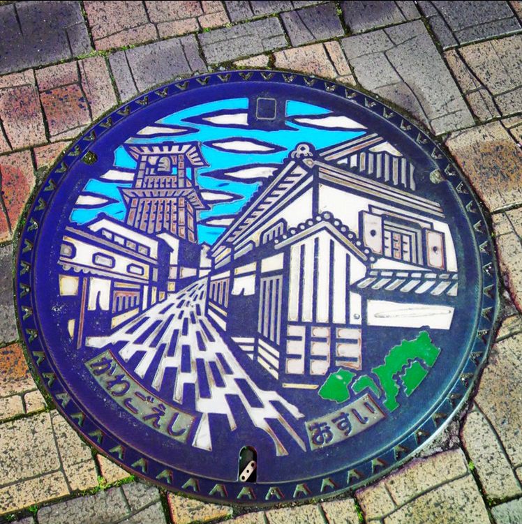Singer Kei Takebuchi spent hours in Kawagoe City to capture this photograph of a manhole cover depicting a historic bell tower.