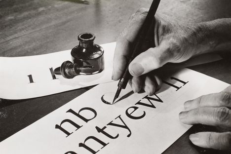 W.A. Dwiggins, hand-drawing letters in 1941.