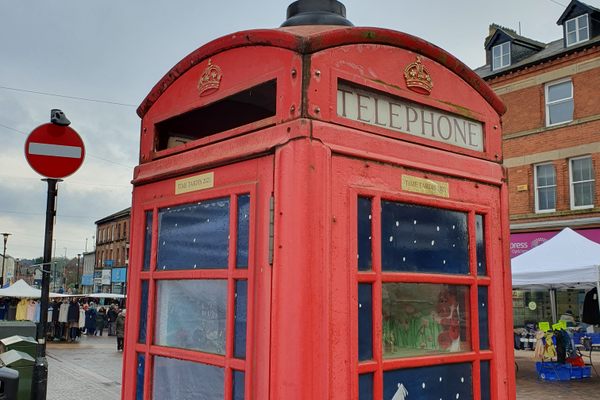 Phone box showing two sides with dioramas.