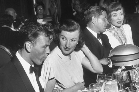 Howard Strickland, head of MGM Publicity (second from right) with Greer Garson. Frank Sinatra and Louella Parsons have other scandals to talk about.