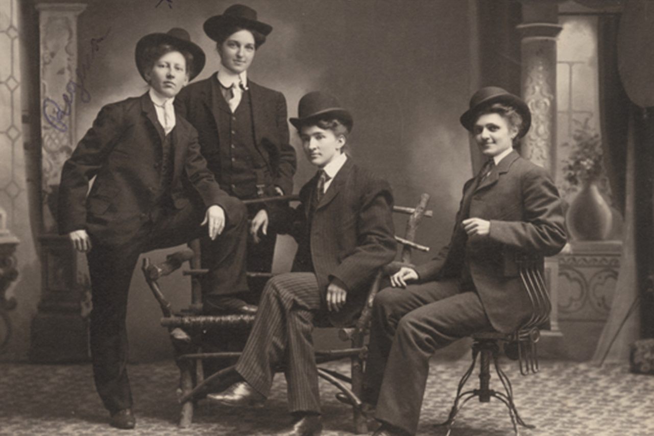 This photo, taken on the Minnesota frontier, depicts Regina Sorenson and three others "dressed in men's suits."
