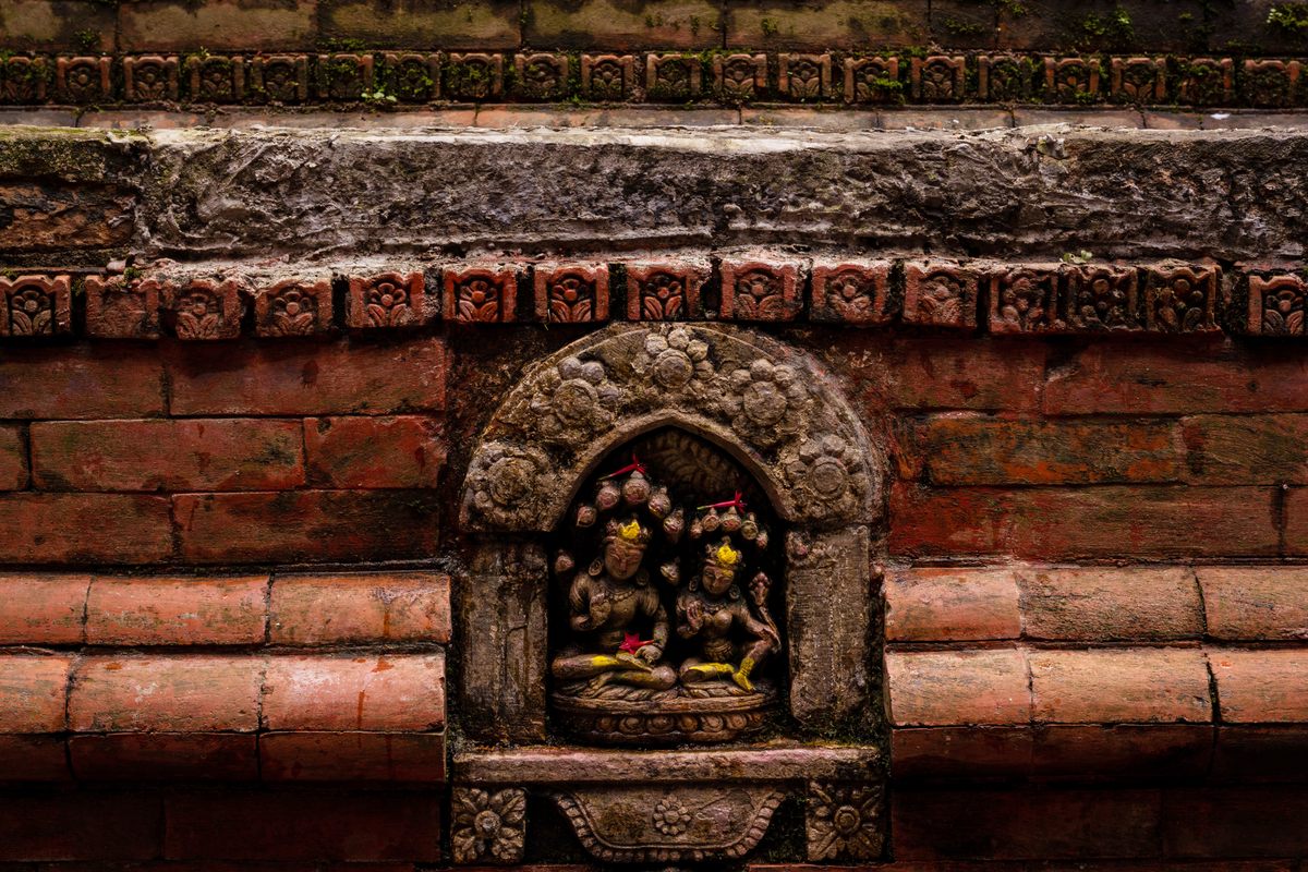 Sculpture of Laxmi Narayan with serpents on the head, located above the water spout at the Lhoo Hiti in the Basantapur neighborhood in Kathmandu. Adding deities to hiti structures not only adds aesthetic value but also confers religious significance, acting as a safeguard against intentional harm to these architectural treasures.