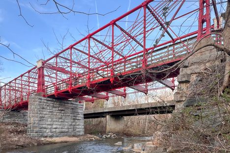 A small trail leads to the river bank where the bottom of the bridge can be viewed