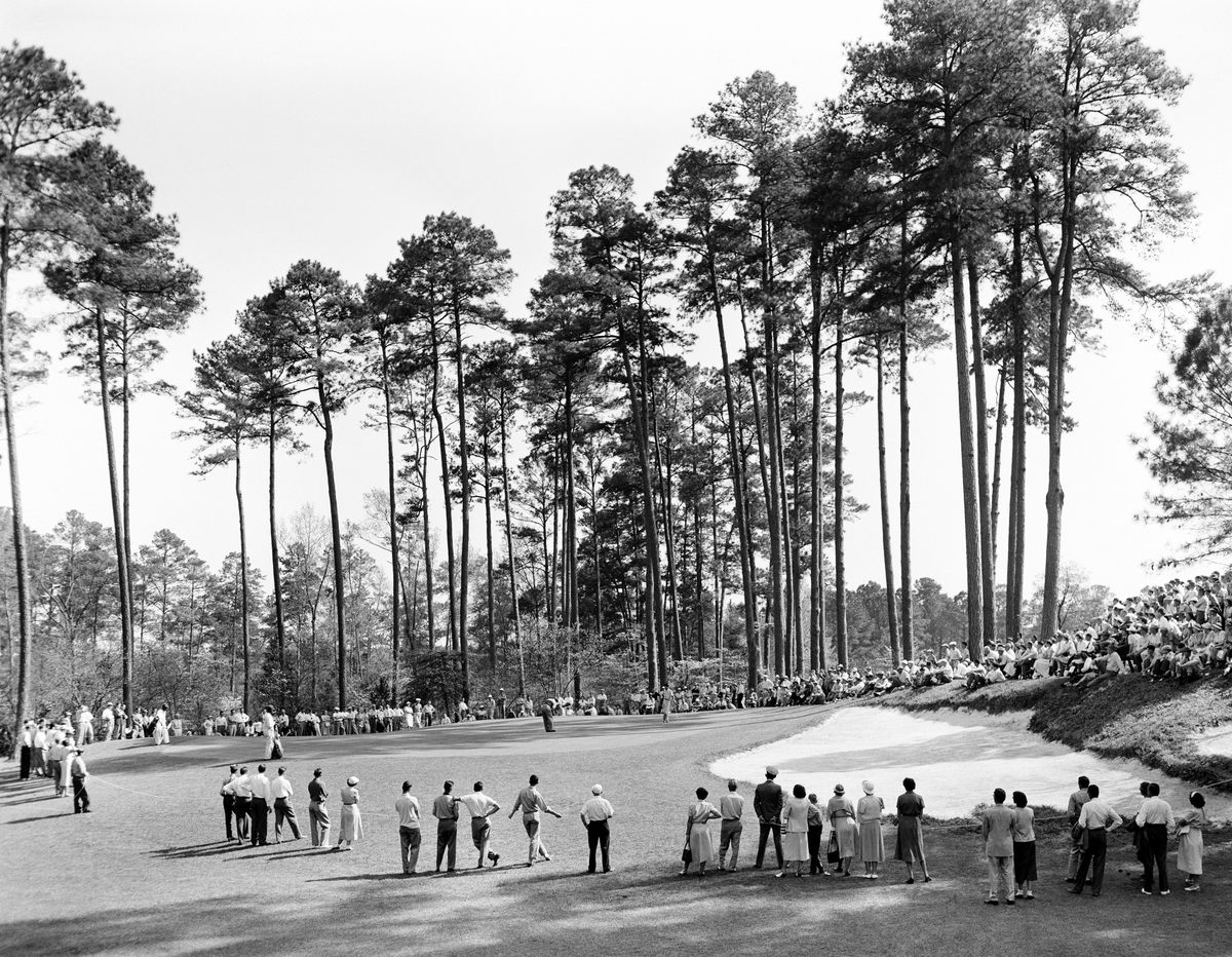 A crowd gathers at the 1950 Masters Tournament at Augusta National Golf Club.