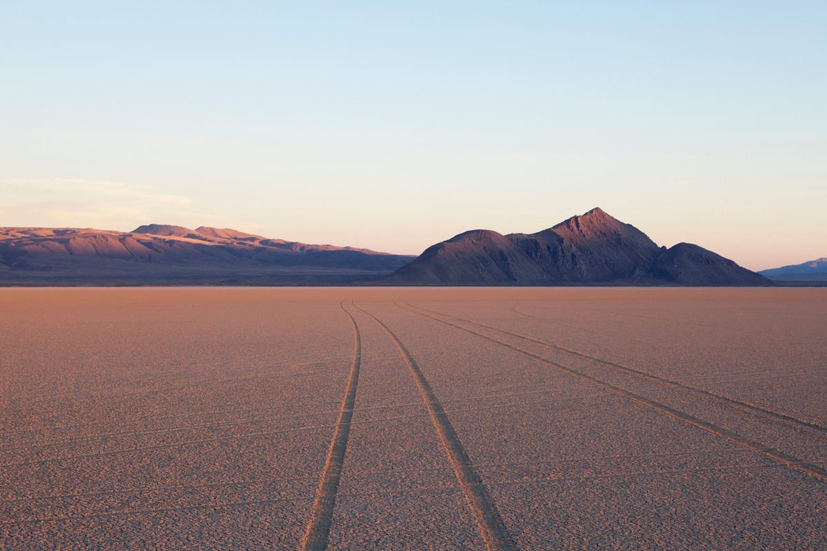 Tire marks and tracks in the playa salt pan surface of Black Rock Desert, Nevada.