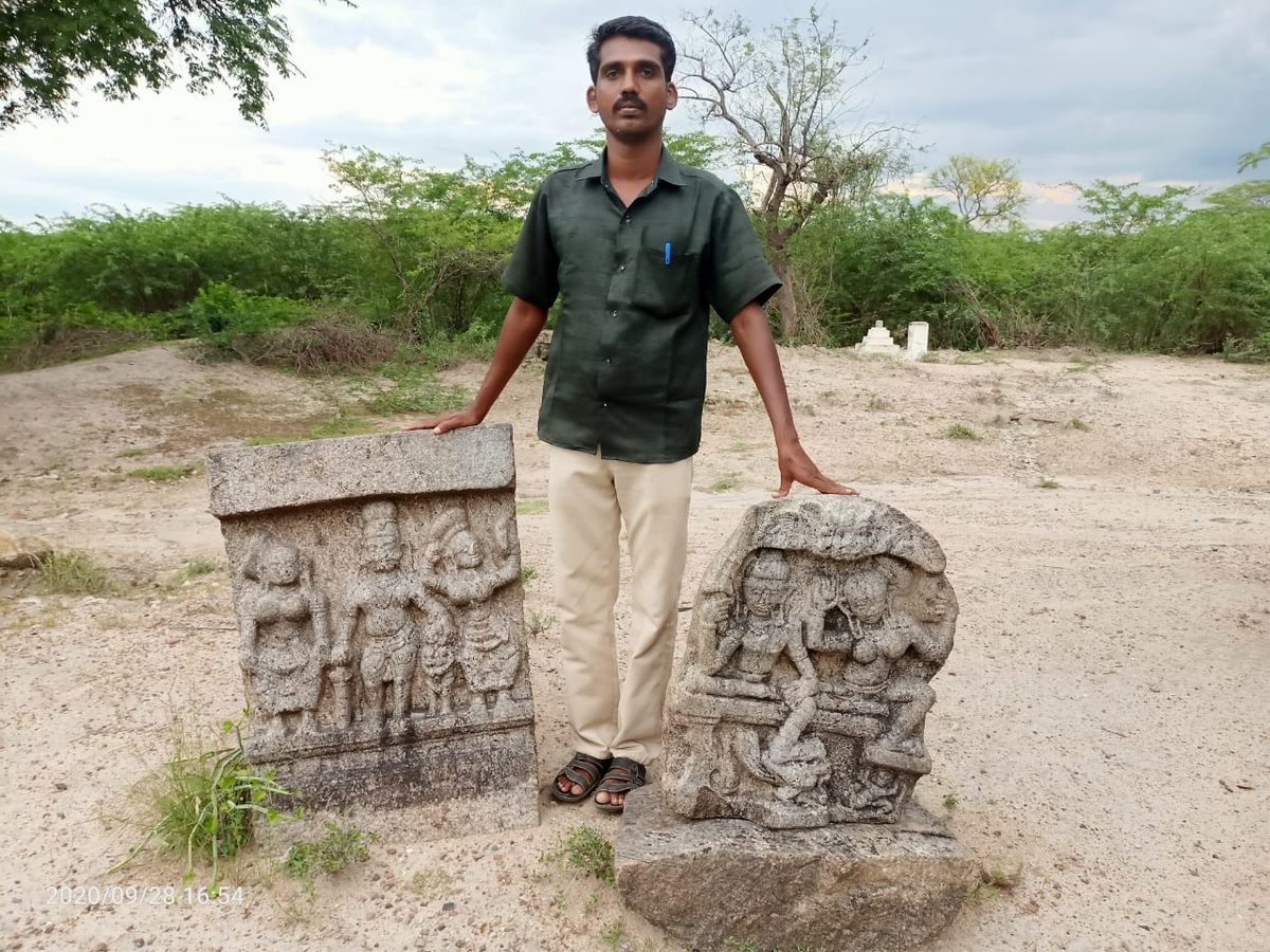 Munaivar Muneeswaran with two of the sati stones he found. The intricacy of the carvings suggest a royal lineage.