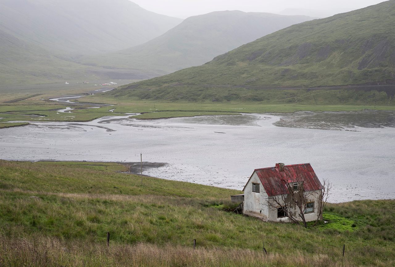 An abandoned cottage by an inlet in Iceland's Westfjords. 