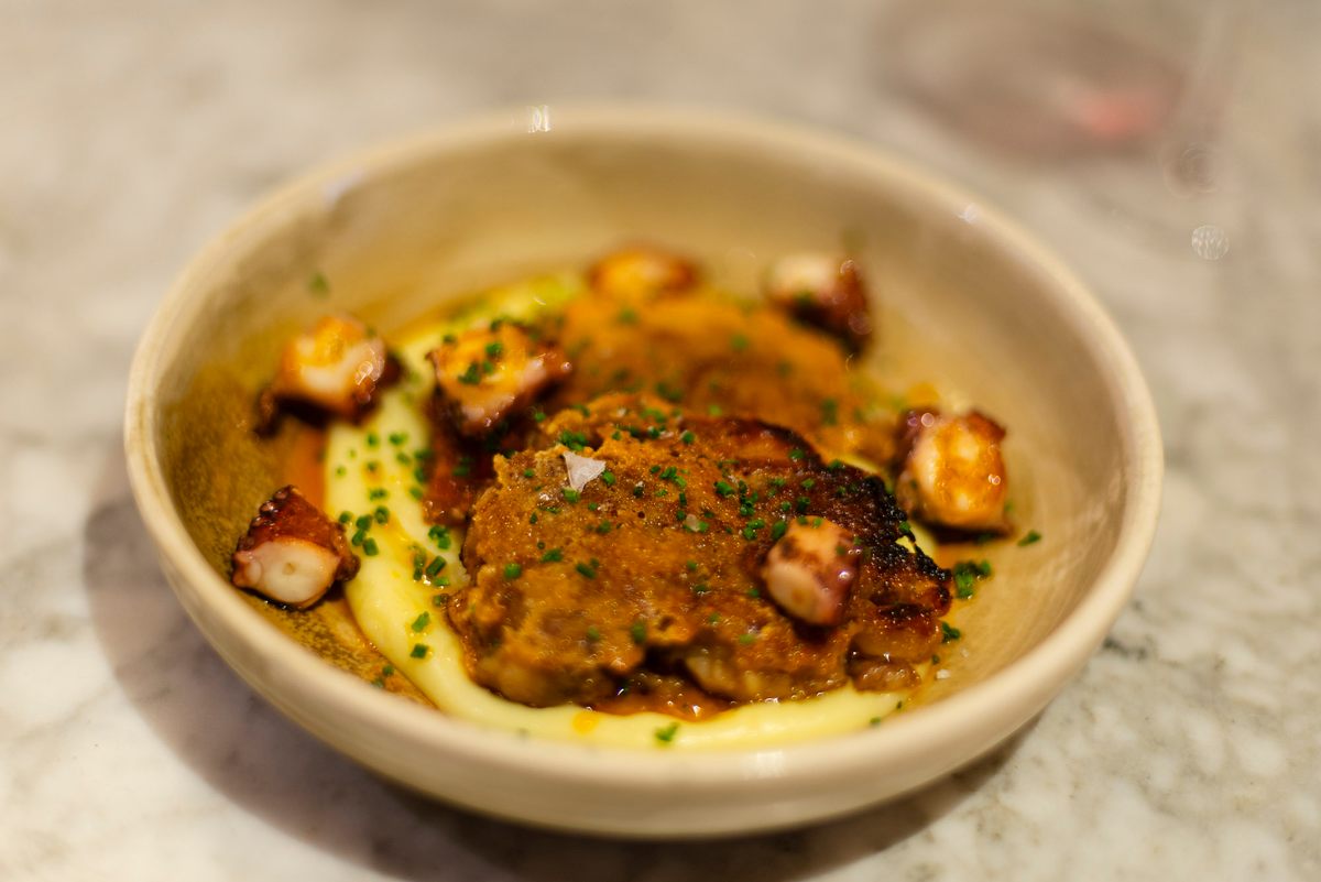 <em>Mar i muntanya</em> or “sea and mountain” is an increasingly rare style of Catalan cooking that pairs meats with seafood—in this case, a pig face and foot terrine with octopus.