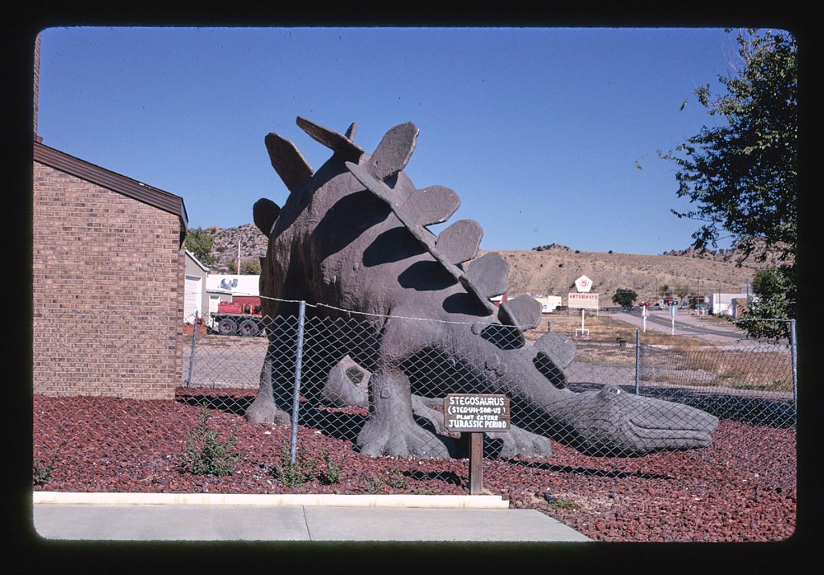 <em>Stegosaurus statue at town hall, view 2, Route 64</em>, Colorado, 1991.