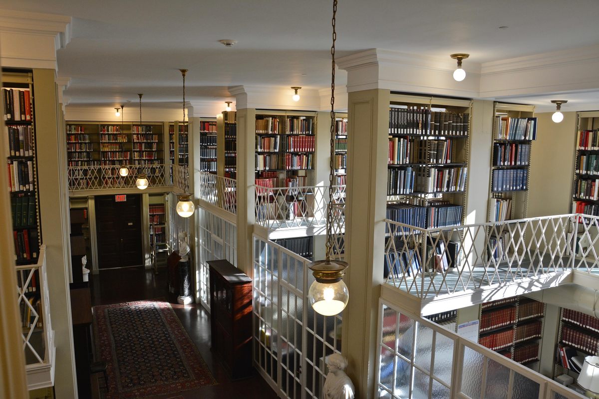 A portion of the Boston Athenaeum's stacks, from which Cushing has rescued many treasures.