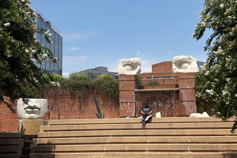 Fragmented marble eyes and enormous lips peer over the terraces of Promenade Classique.