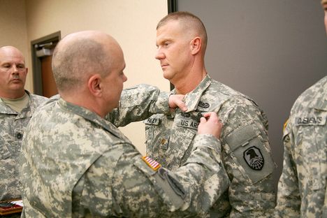A major, earning his Space Badge in 2014