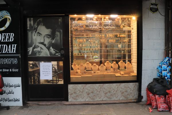 Saddam Hussein's face decorates the door of a gold shop in the Jabal Amman neighborhood of Amman. The owner, Adeeb, says his father studied in Baghdad before returning to Jordan and joining the intelligence service.
