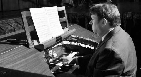 Bernie Anderson at an organ. 