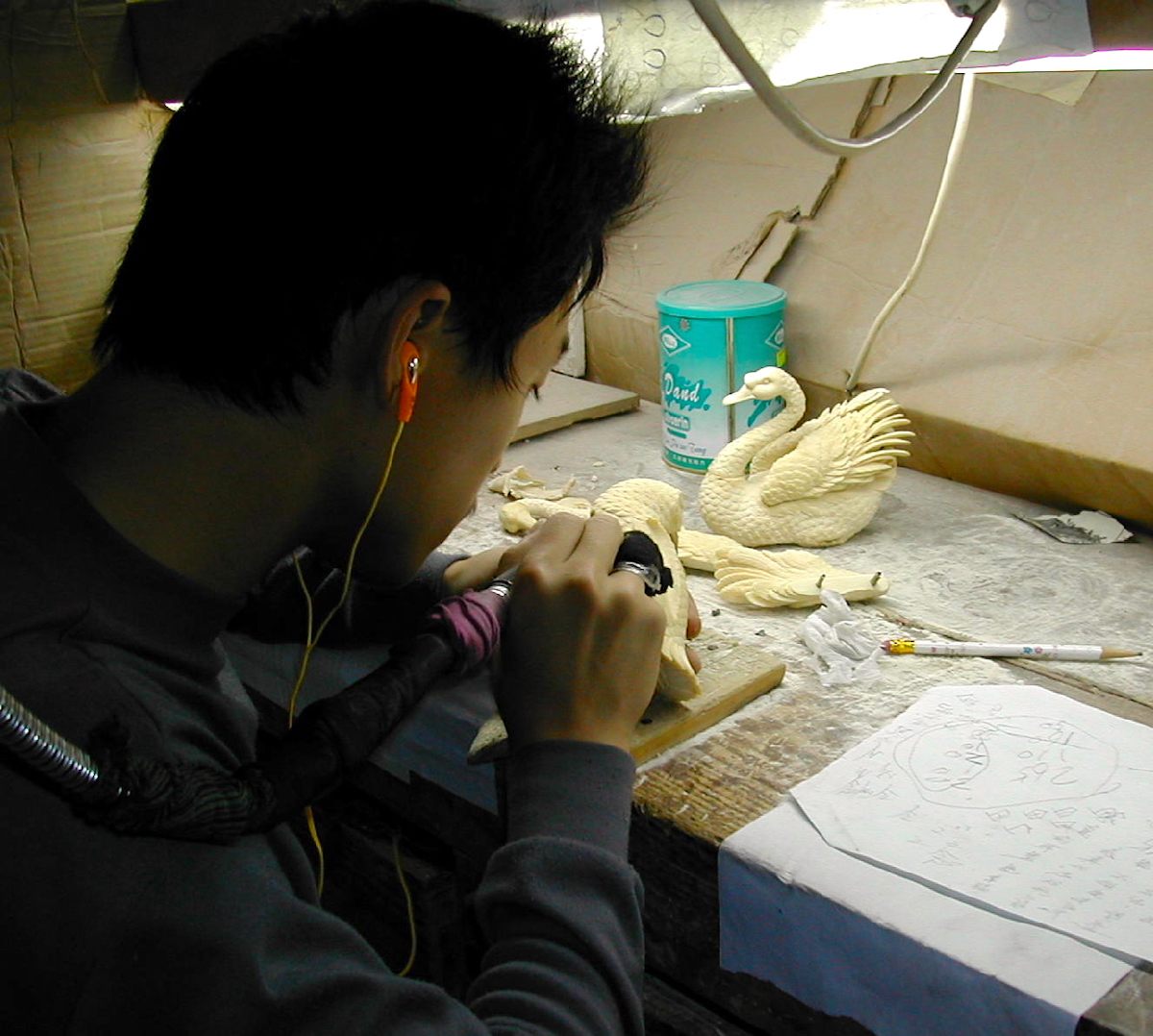 Mammoth ivory being carved in a Chinese workshop.